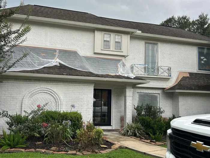Elegant white brick two-story home exterior repaint