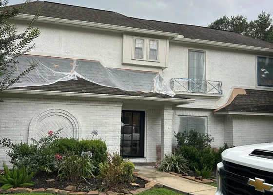 Upscale two-story brick home exterior in The Woodlands, TX
