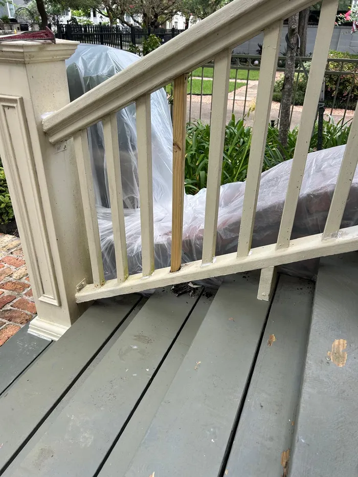 Porch railing repair and painting close-up