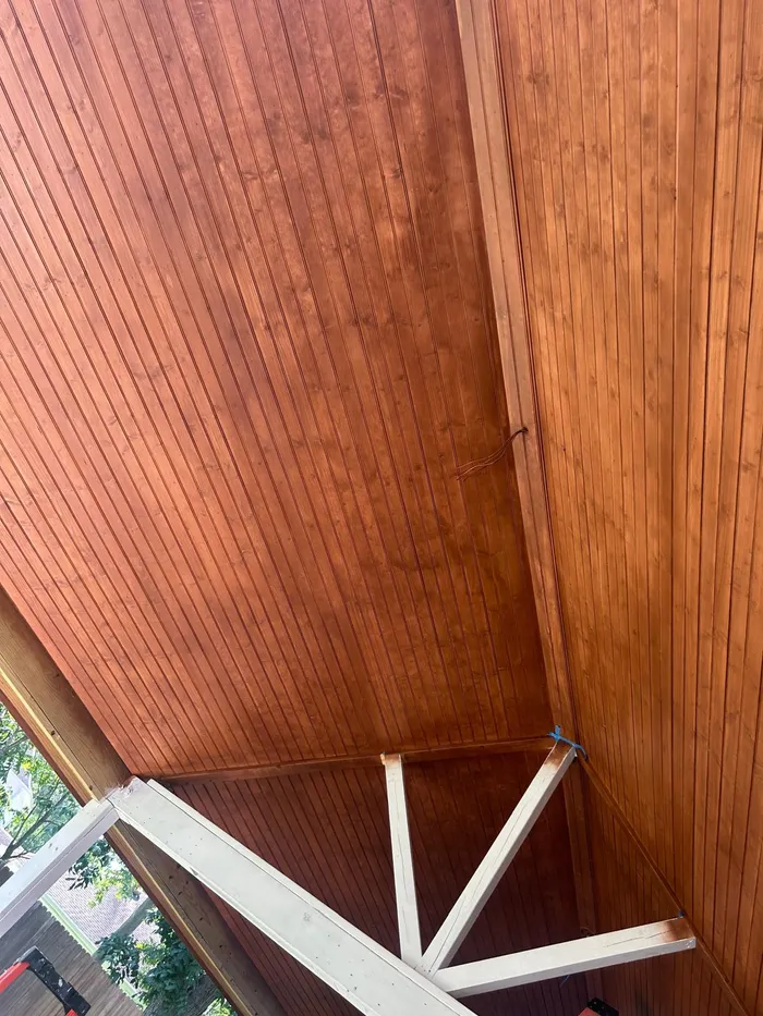 Close-up of a stained wood covered patio ceiling