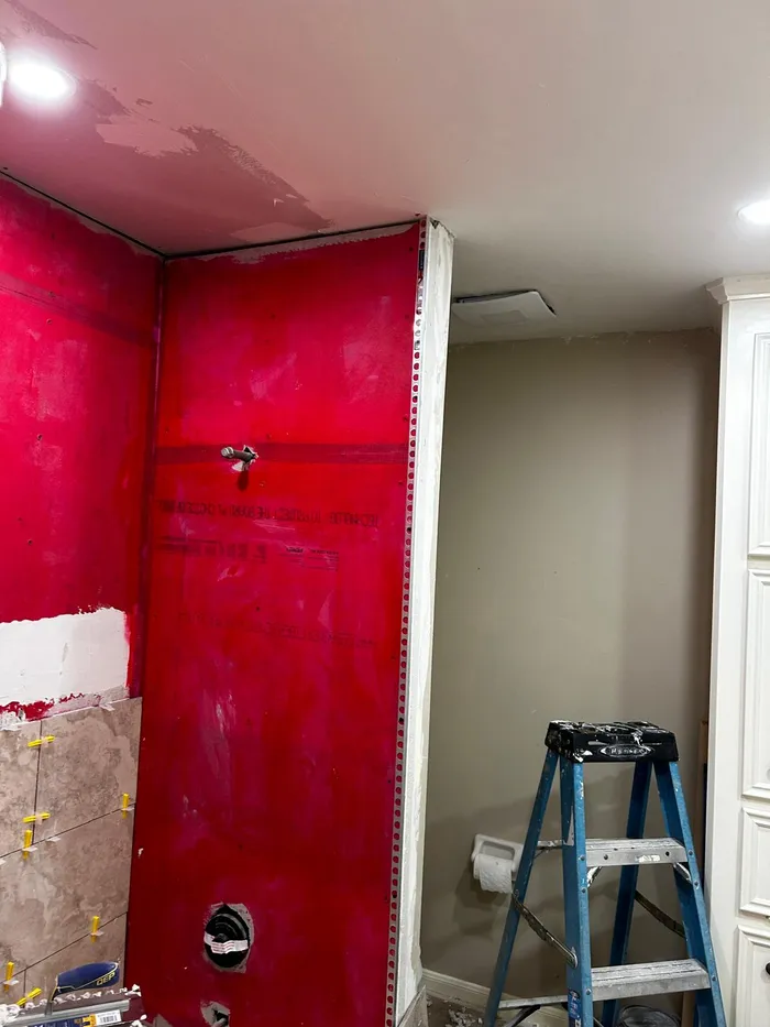 Waterproof membrane board installed on shower walls before tiling